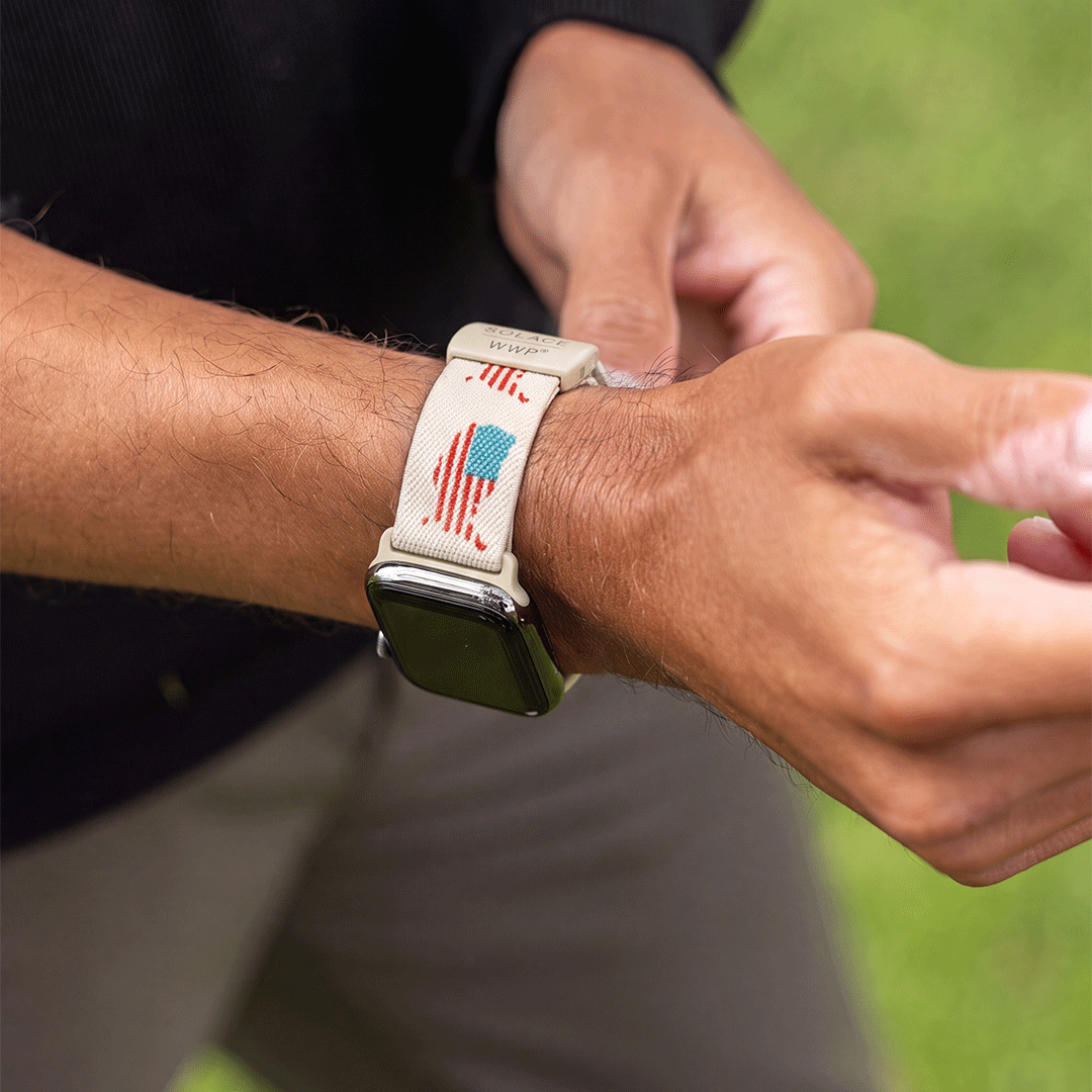 a person wearing a usa themed watch band for apple watch